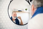 Senior man brushing his teeth