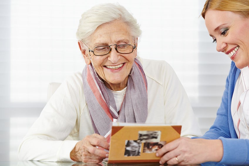 Senior woman talking with caregiver