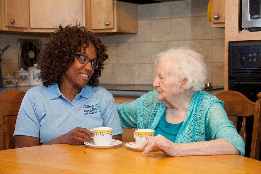Visitng Angels caregiver with elderly woman