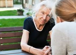 Ederly woman discussing elderly abuse with daughter