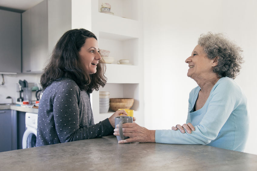 Elderly woman talking to adult daughter
