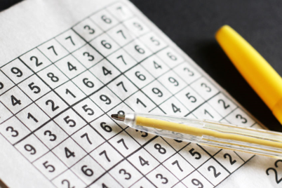 Sudoku puzzle and ballpoint pen