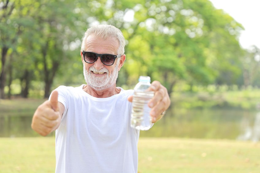 Elderly man exercising outside