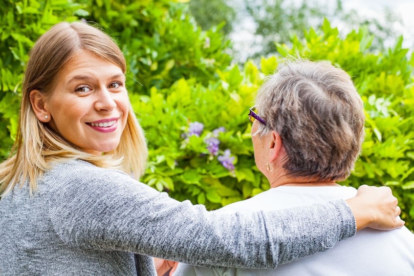 Family caregiver with elderly woman