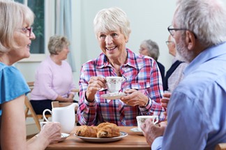 Seniors talking at a social gathering