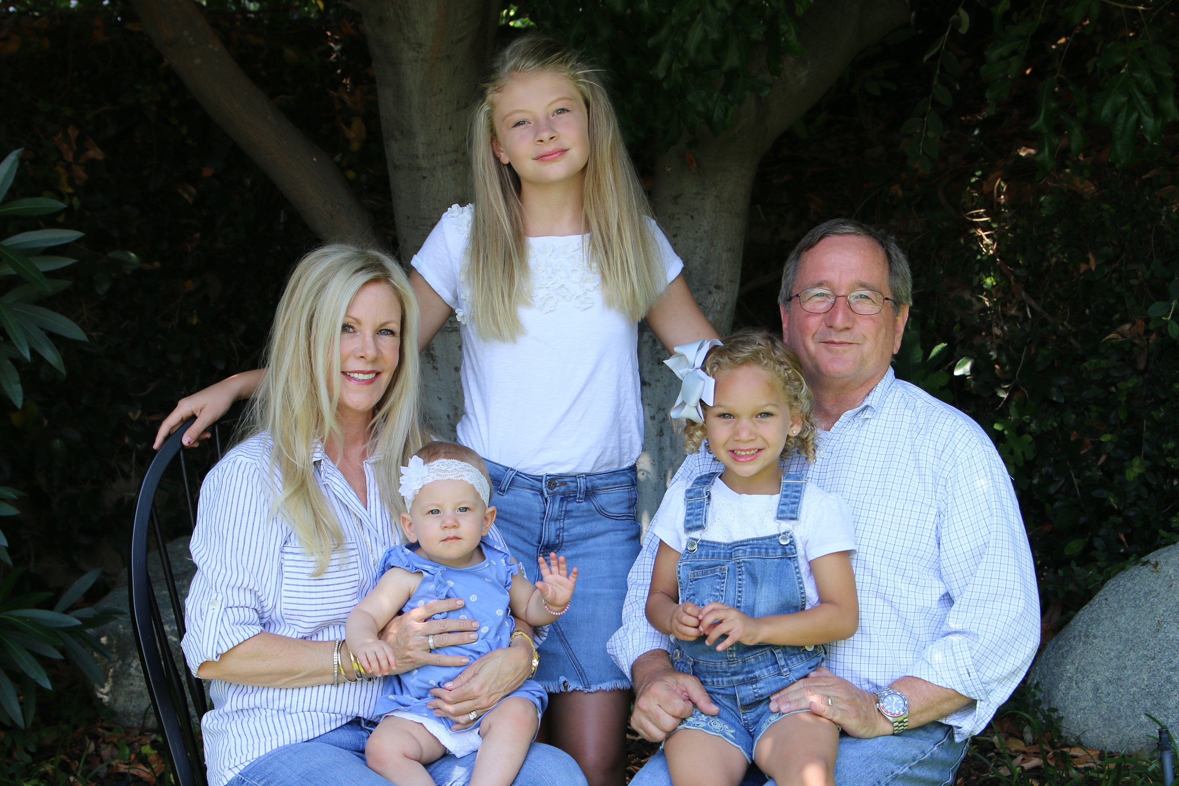 Tisha and Doug Montague with their three grandchildren.