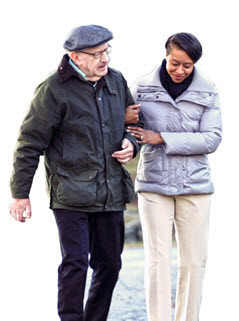 Senior man walking with home care aide from Visiting Angels of Raleigh