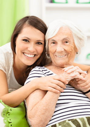 Caregiver from Visiting Angels Loveland hugging elderly woman