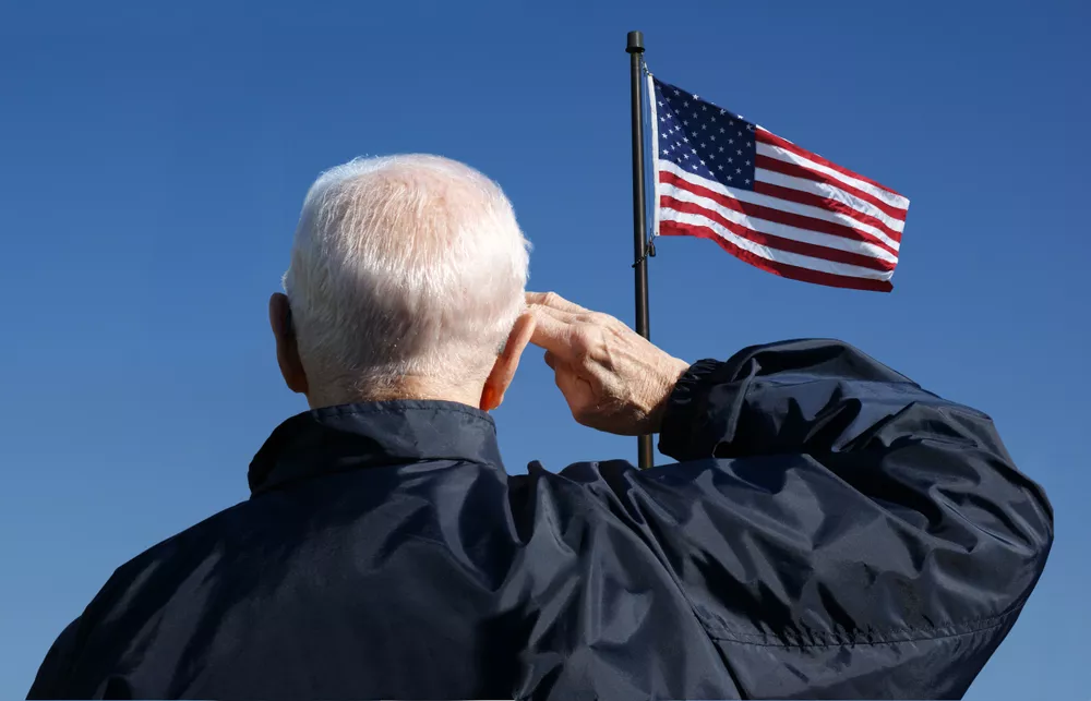 Veteran Saluting the American Flag