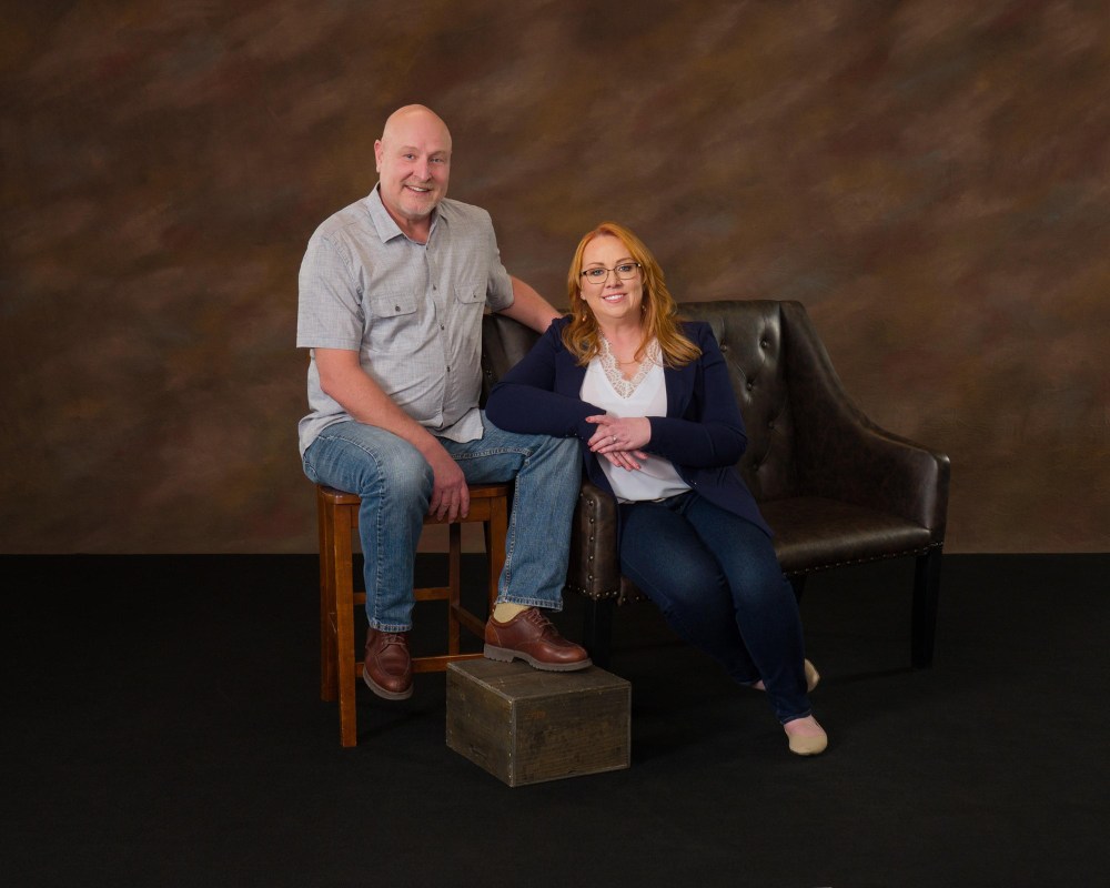 sitting portrait of christine rose-vanwormer and husband toby