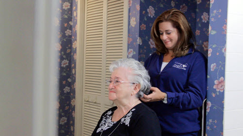 home care provider helps client prepare for the day