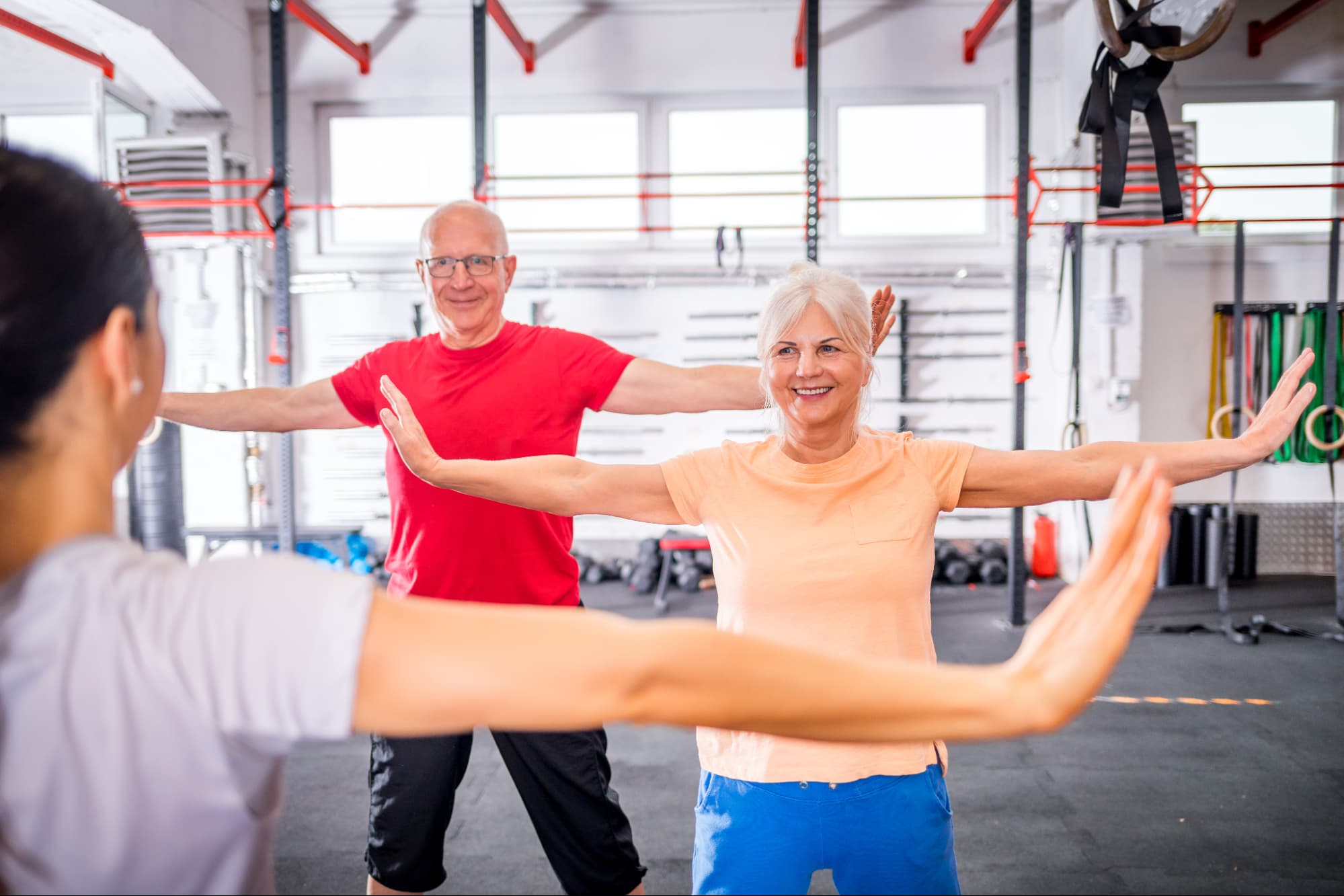 Older man and woman exercising