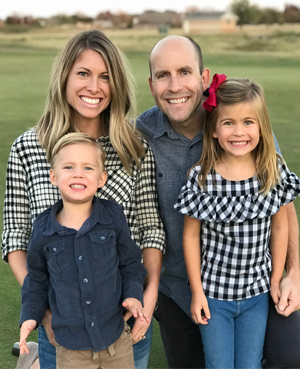 Derik Schneider, owner of Visiting Angels Wichita Falls, TX, with his wife, Sarah, and two children.